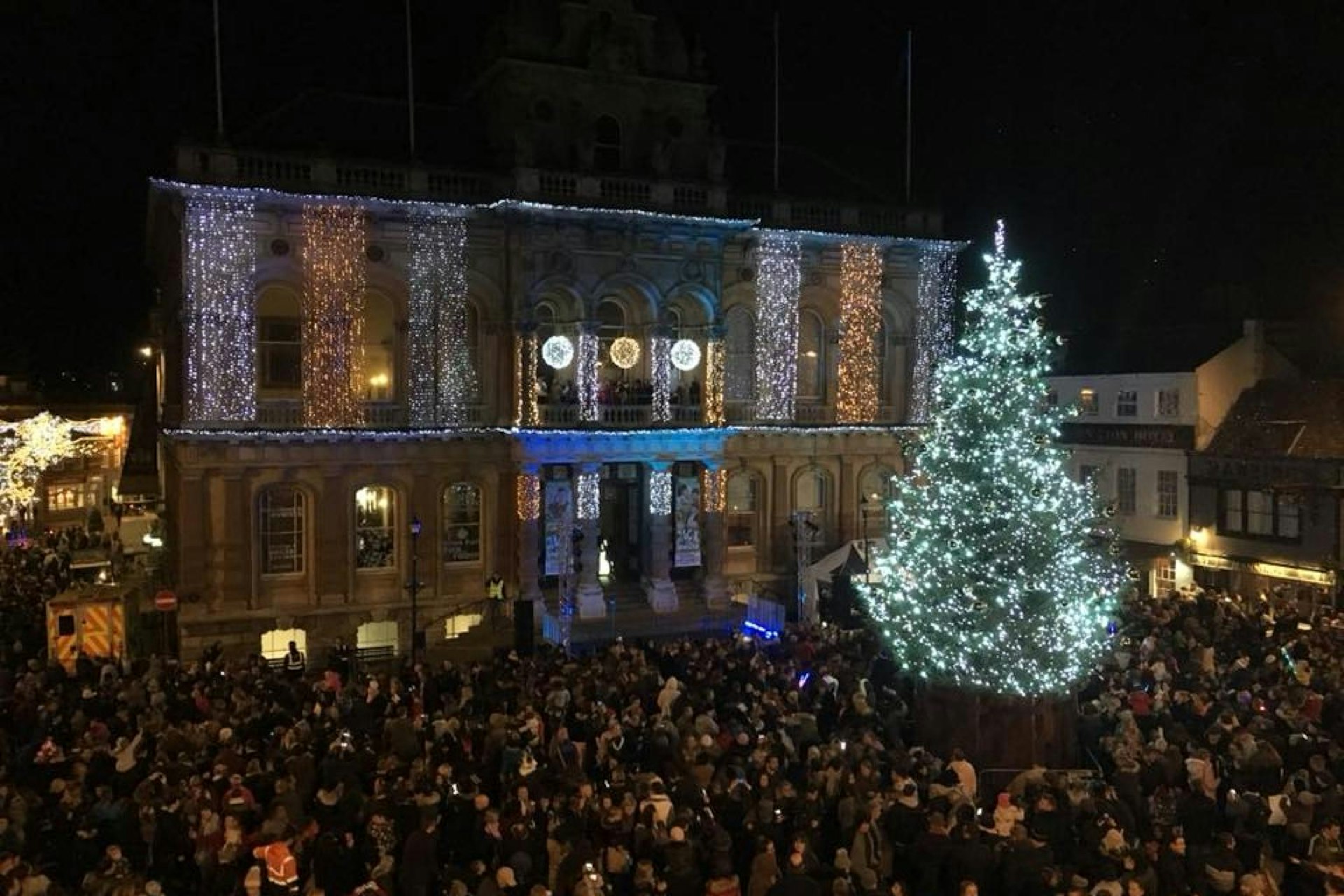Christmas tree and crowd of people